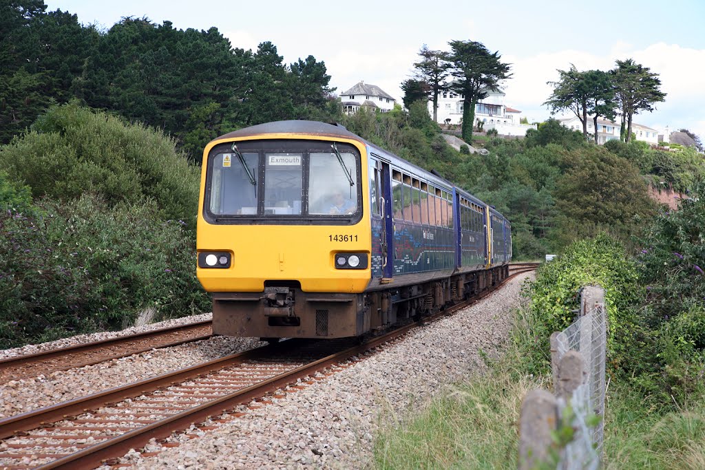 143611 leads the 11:24 Exemouth to Paignton at Hollicombe, between Torquay and Paignton on Sunday 26/8/2012.