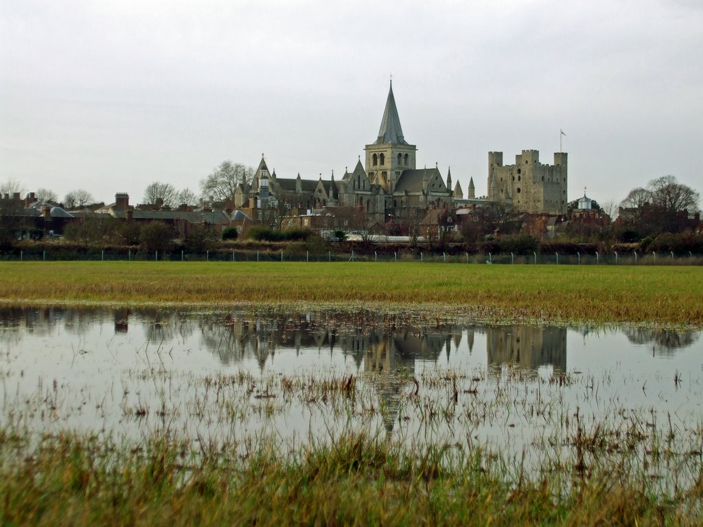 Rochester cathedral and castle with reflections in a puddle