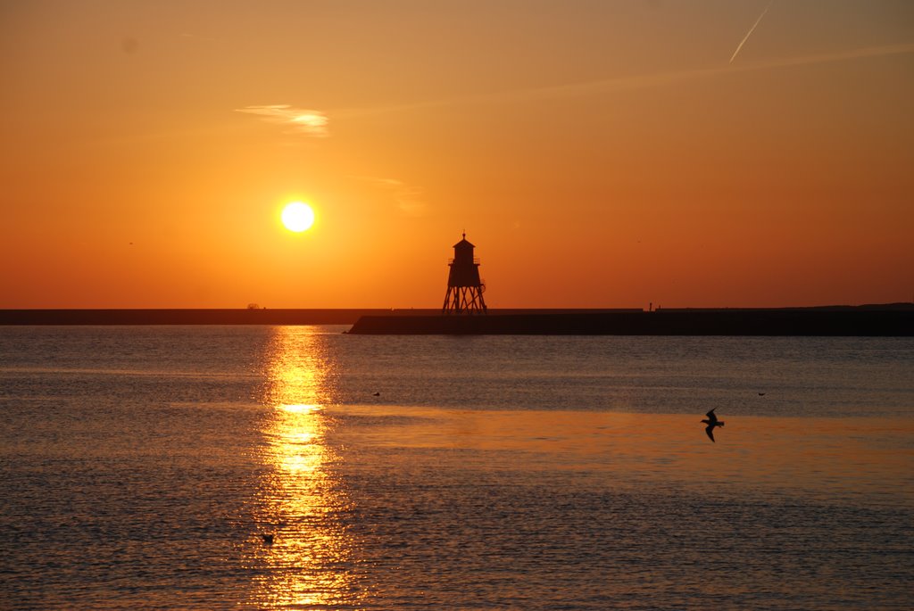 Beautiful golden sunrise over Herd Groyne, South Shields