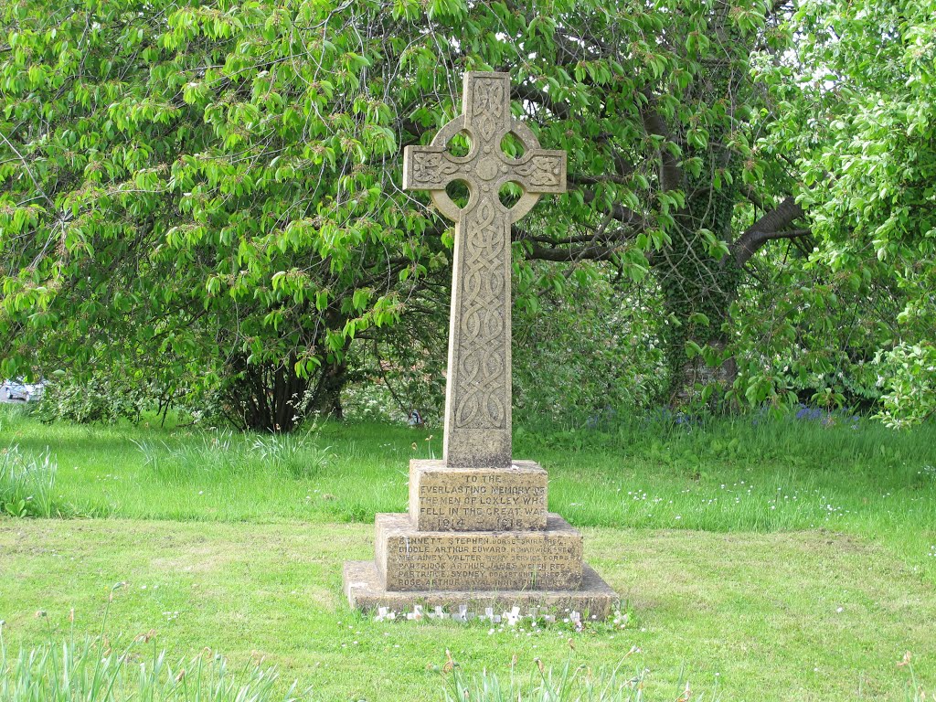 Loxley, Warwickshire, England. This Celtic style cross is the village war memorial for WWI and WWII.  27th May 2013.