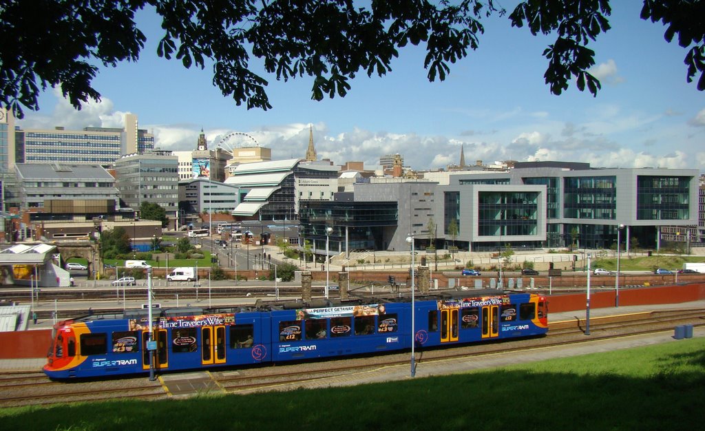 Supertram passing Sheffield railway station with the city centre behind, Sheffield S2/S1