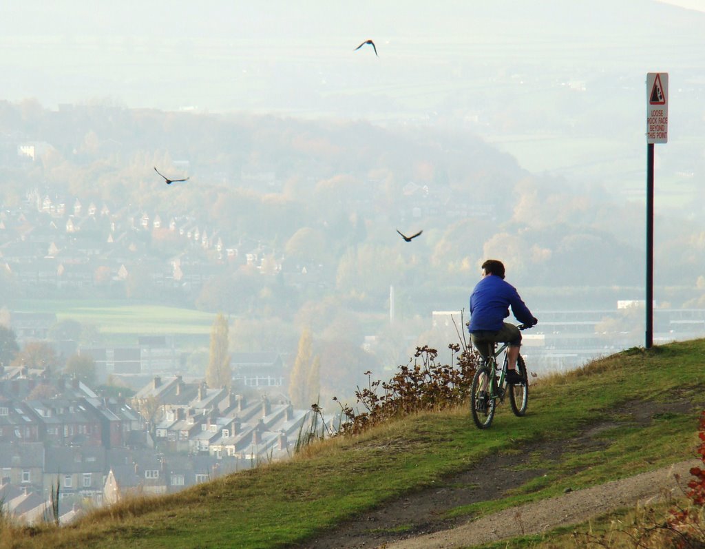 Cyclist admiring the view from Parkwood Springs, Sheffield S3