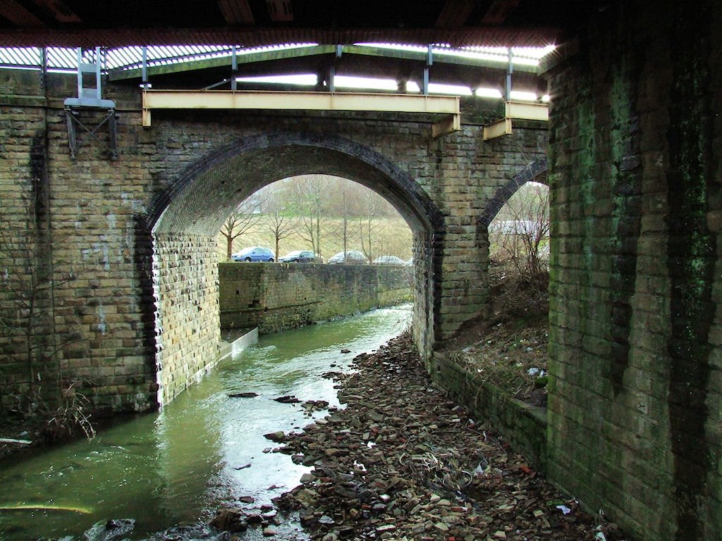 Bradford Beck passes under the railway bridges on Briggate
