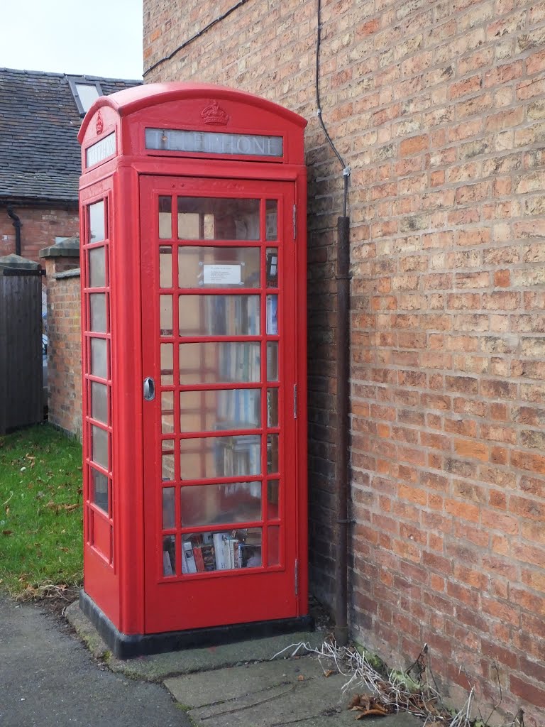 The Telephone Box book store, Opposite The Cock Inn at Sheppy, Witherley, Leicestershire, UK.