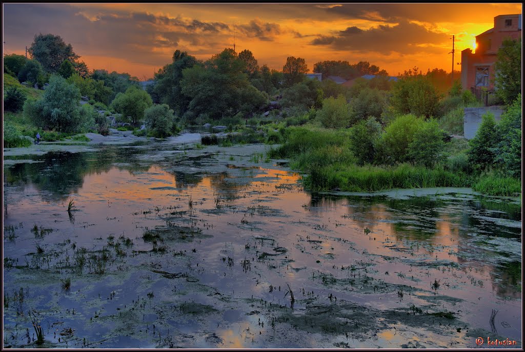 Sunset over Bohuslav. River Ros.