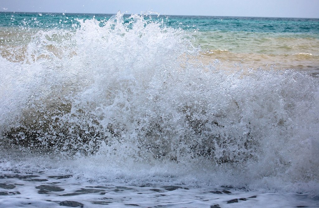 Turning out in the waves and splashing into them, embraced!