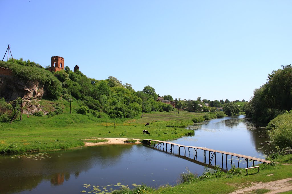 Korets castle. The view with the wooden bridge across the river Korchik.