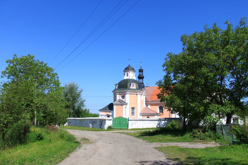 Korets. Polish Roman Catholic church from the village street.