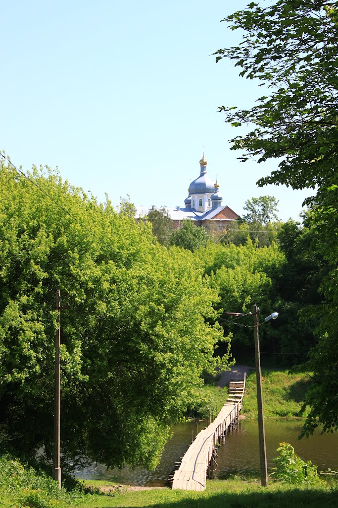 Korets. The view the wooden bridge and the Ressurection church.