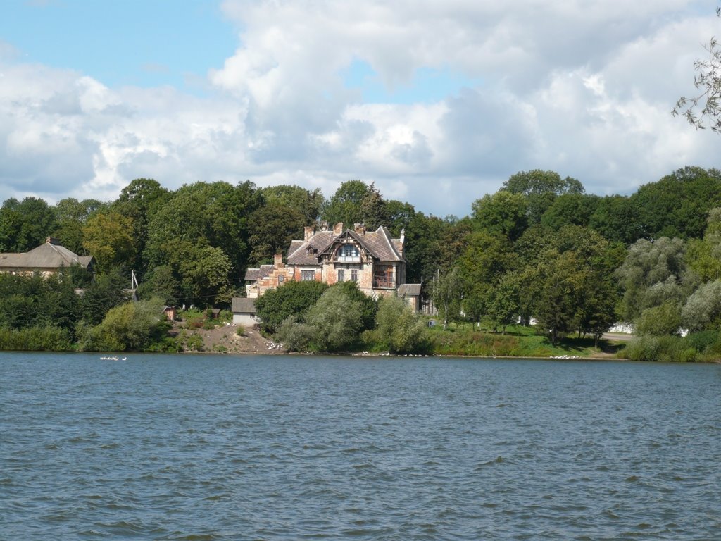 The old house behind the pond