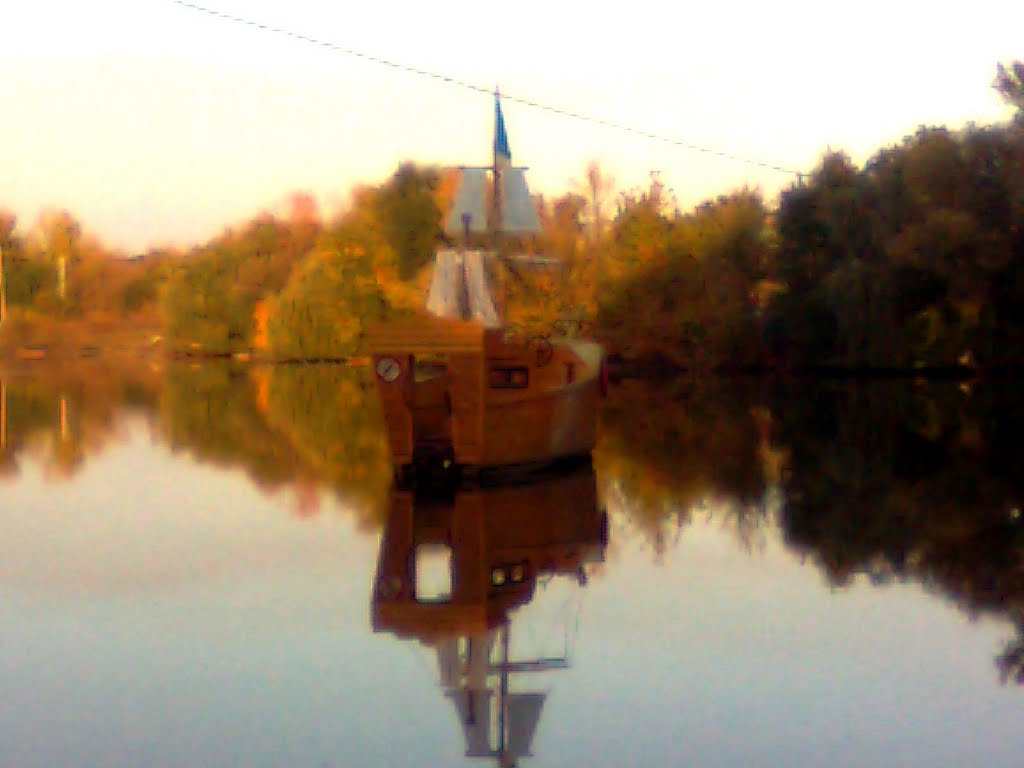 a boat in the water -mirror...
